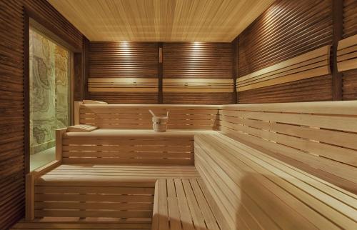 an empty sauna with wooden walls and wooden floors at Radisson Blu Hotel & Spa, Istanbul Tuzla in Istanbul