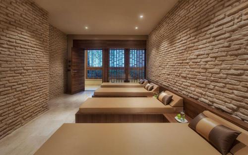 a row of benches lined up against a brick wall at Radisson Blu Hotel & Spa, Istanbul Tuzla in Istanbul