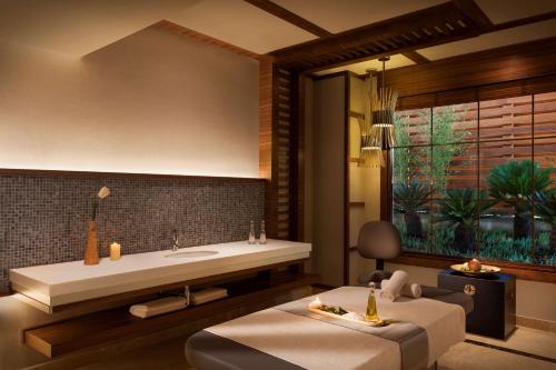 a bathroom with a sink and a bath tub at Radisson Blu Hotel & Spa, Istanbul Tuzla in Istanbul
