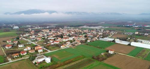 an aerial view of a town with houses and fields at Estilo luxury apartment in Kavala