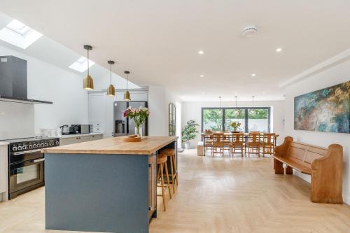 a kitchen and living room with a table and chairs at Old Chapel in Gainsborough