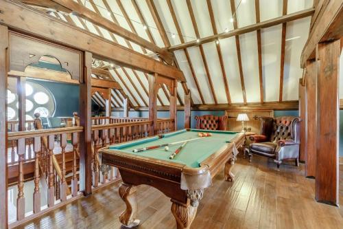 a pool table in a room with wooden ceilings at Old Chapel in Gainsborough
