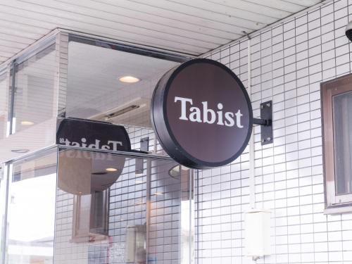 a sign that reads talbotisk on the side of a building at Tabist Travel Inn Shinshu Nakano in Nakano