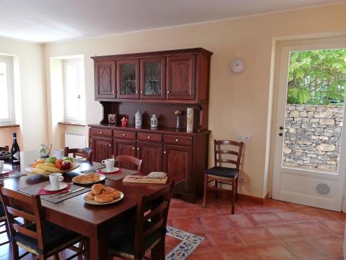 a kitchen with a table with food on it at Case Vacanze Borgo Faraldi in Villa Faraldi