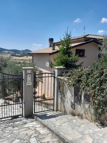 a black gate in front of a house at I Gufetti 2 in San Savino