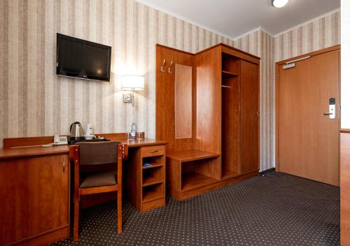 TV a/nebo společenská místnost v ubytování Premium Hotel Bacero Wrocław