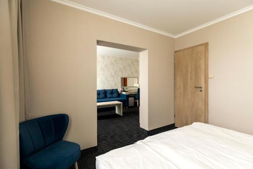 Ένα ή περισσότερα κρεβάτια σε δωμάτιο στο Hotel Almarco