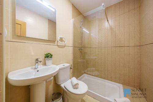 a bathroom with a sink and a toilet and a shower at MALAGA CENTRAL SUITES - New Release in Málaga