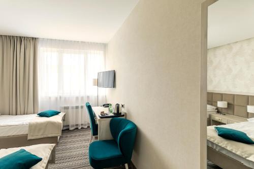 Ένα ή περισσότερα κρεβάτια σε δωμάτιο στο Hotel Almarco