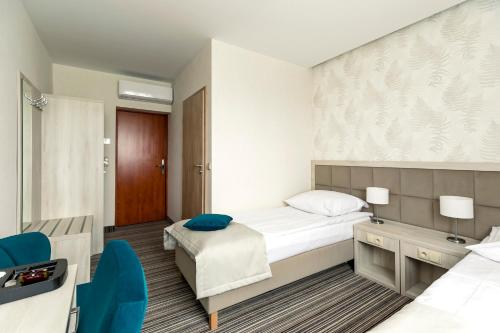 Ένα ή περισσότερα κρεβάτια σε δωμάτιο στο Hotel Almarco