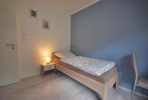 Cama o camas de una habitación en Ferienwohnung Up Hobarg 35523