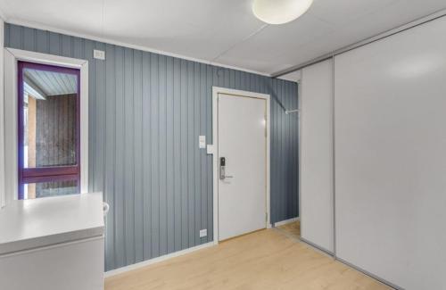 an empty room with a door and a window at FeelHome 4 bedrooms apartment Polarvegen in Tromsø