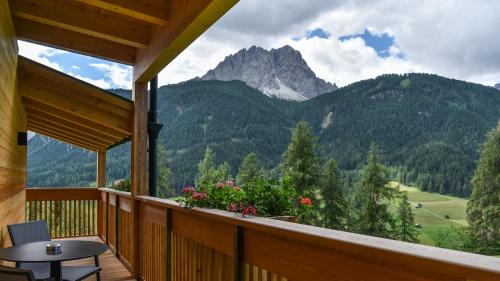 a balcony with a view of a mountain at Im Wiesengrund Apartments in Sesto
