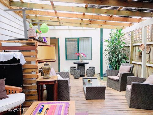 a patio with wicker chairs and a table at Boxhill 短租房 in Box Hill