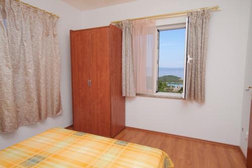 Posteľ alebo postele v izbe v ubytovaní Apartment Njivice 5458e