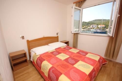 Ένα ή περισσότερα κρεβάτια σε δωμάτιο στο Apartment Zaglav 8144a