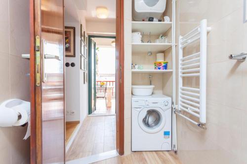 a laundry room with a washer and dryer at Studio Makarska 11063b in Makarska