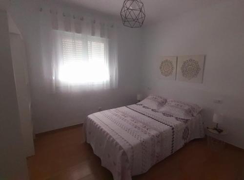 Ένα ή περισσότερα κρεβάτια σε δωμάτιο στο Apartamento CampoMar