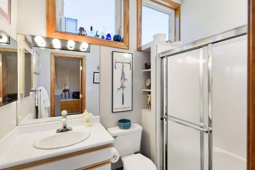 a bathroom with a toilet and a sink and a shower at Seasons Four 172 Two bedroom plus loft in Snowmass Village