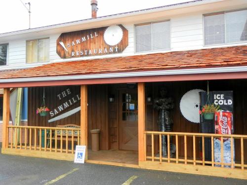 a restaurant with a sign on the front of a building at Alpine Lodge in Davis