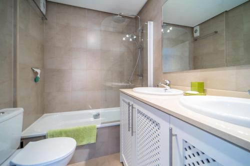 a bathroom with a sink and a toilet and a tub at Lovely Apartment with Wrap Around Terrace Golf Views - AO1713LT in Torre-Pacheco