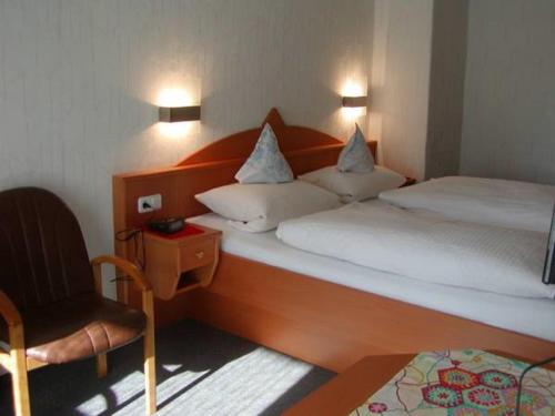 Ένα ή περισσότερα κρεβάτια σε δωμάτιο στο Kurhotel Eichwaldeck