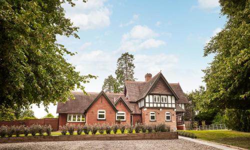 a house with a gambrel roof at Brockencote Hall in Kidderminster