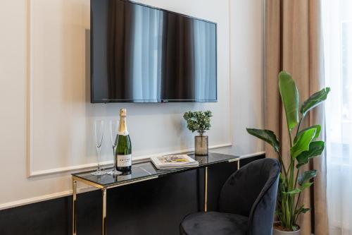 Televízia a/alebo spoločenská miestnosť v ubytovaní AR Apartamenty