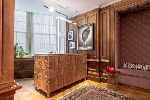a lobby with wood paneling and a podium with a window at Virgin Hotels Edinburgh in Edinburgh