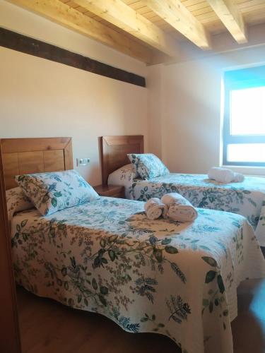 Postel nebo postele na pokoji v ubytování Casa Marite Vivienda de uso turístico