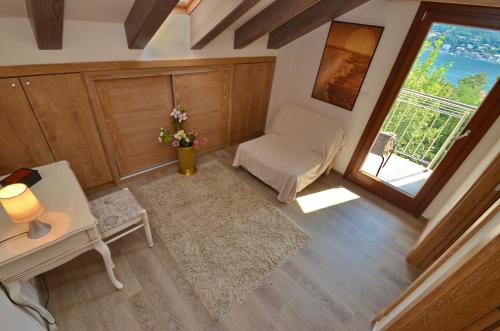 an overhead view of a living room with a chair and a window at Apartments Olive in Kotor