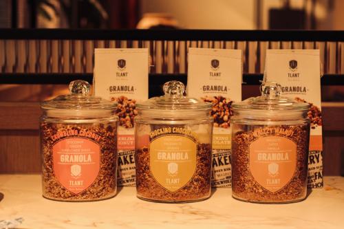 a group of four jars of food on a table at The Market Hotel in Groningen