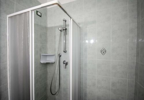 a shower with a glass door in a bathroom at Hotel San Pietro Chiavari in Chiavari