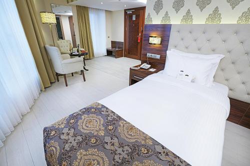 Ένα ή περισσότερα κρεβάτια σε δωμάτιο στο World Point Hotel Istanbul