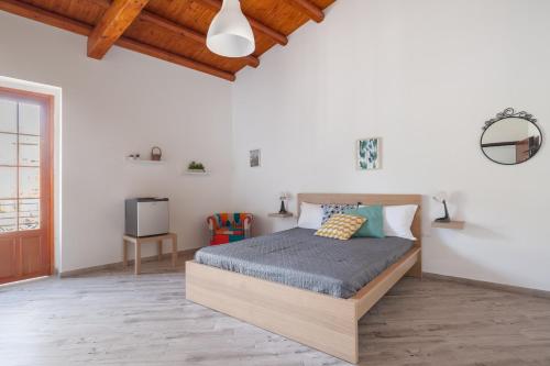 Posteľ alebo postele v izbe v ubytovaní Danisinni Rooms by Wonderful Italy