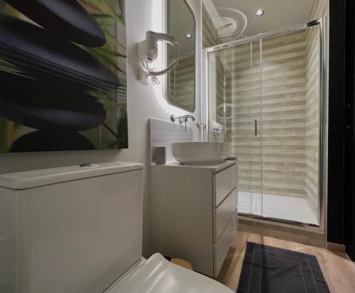 a bathroom with a sink and a toilet at G&W Luxury Rooms in Athens