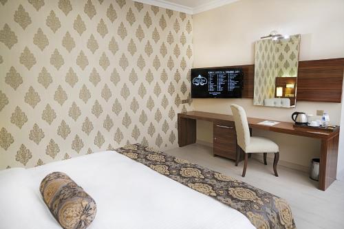 Ένα ή περισσότερα κρεβάτια σε δωμάτιο στο World Point Hotel Istanbul
