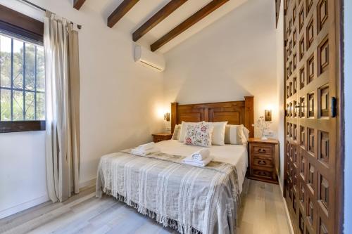 Posteľ alebo postele v izbe v ubytovaní Villas Guzman - San Jaime