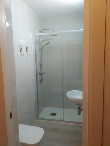 a bathroom with a shower and a sink at APARTAMENTO RAFER in Ribadeo