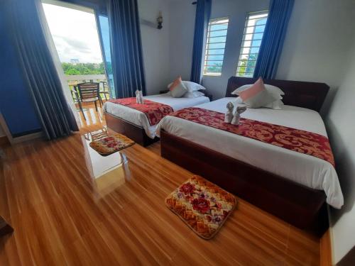 Katil atau katil-katil dalam bilik di Realkhom Villa