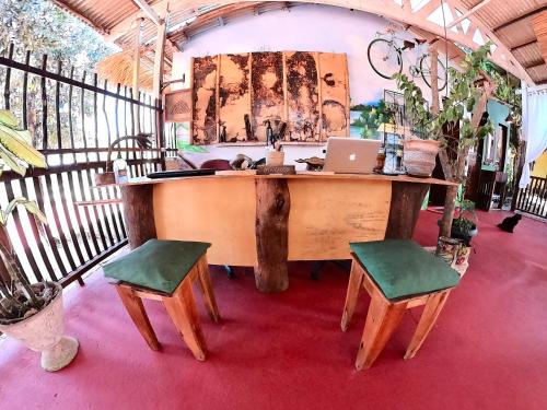 an office with a desk with a laptop and two chairs at Pousada Ocazum in Alter do Chao
