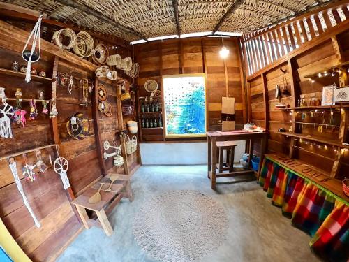 a room with a table and a chair in a room at Pousada Ocazum in Alter do Chao