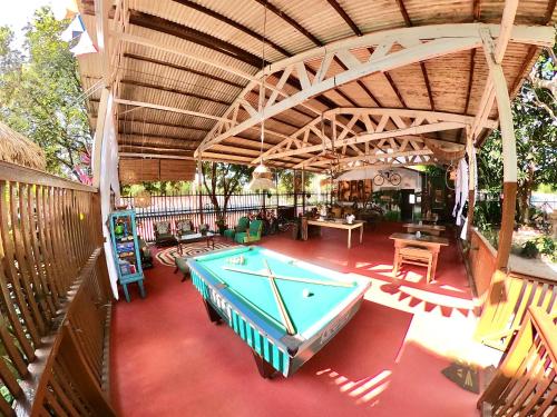an overhead view of a pool table on a patio at Pousada Ocazum in Alter do Chao