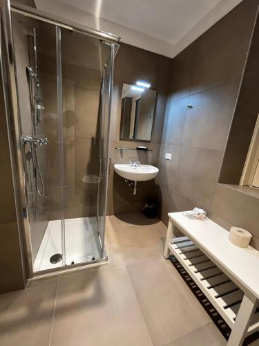 a bathroom with a shower and a sink at Bilo - Apartments for rent in Trento