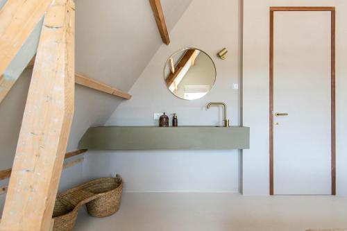 a bathroom with a sink and a mirror at Dok 20, Lemmer in Lemmer
