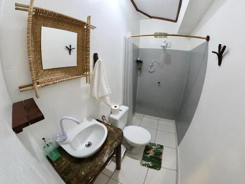 a bathroom with a sink and a toilet at Pousada Ocazum in Alter do Chao