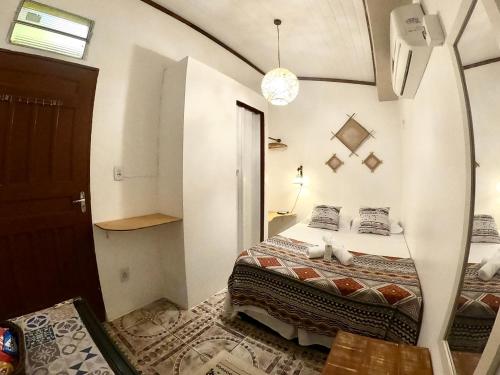 a bedroom with a bed in a room at Pousada Ocazum in Alter do Chao