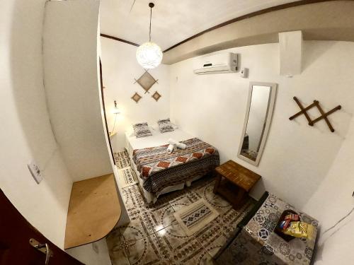 an overhead view of a bedroom with a bed and a mirror at Pousada Ocazum in Alter do Chao