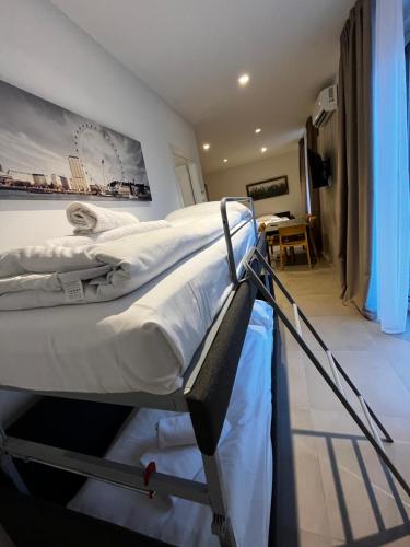 a bedroom with two bunk beds and a desk at Bilo - Apartments for rent in Trento