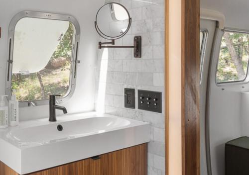 a bathroom with a sink and a mirror at AutoCamp Cape Cod in Falmouth